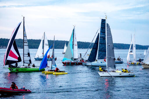 Some of the 42 human- and wind-powered watercraft leave Port Townsend at the sound of the 5 a.m. cannon blast on Sunday that signaled the start of the Race 2 Alaska, a 750-mile voyage to Ketchikan. The winning team will collect $10,000 and the second-place finisher will earn a set of steak knives. (Steve Mullensky/for Peninsula Daily News)