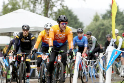 Cyclists ride around Worthington Park in Quilcene as part of the Bon Jon Pass Out in 2023. More than 300 cyclists are expected to descend on Quilcene this weekend. (David Goetze)