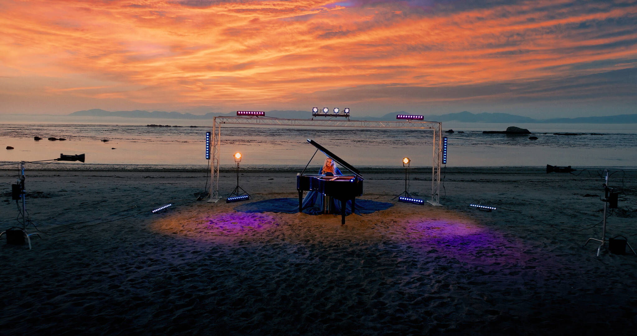 For her “Oceans” music video, Jennifer Thomas, her husband Will and son Preston set up a grand piano and light display at Bullman Beach in Sekiu. (Jennifer Thomas)