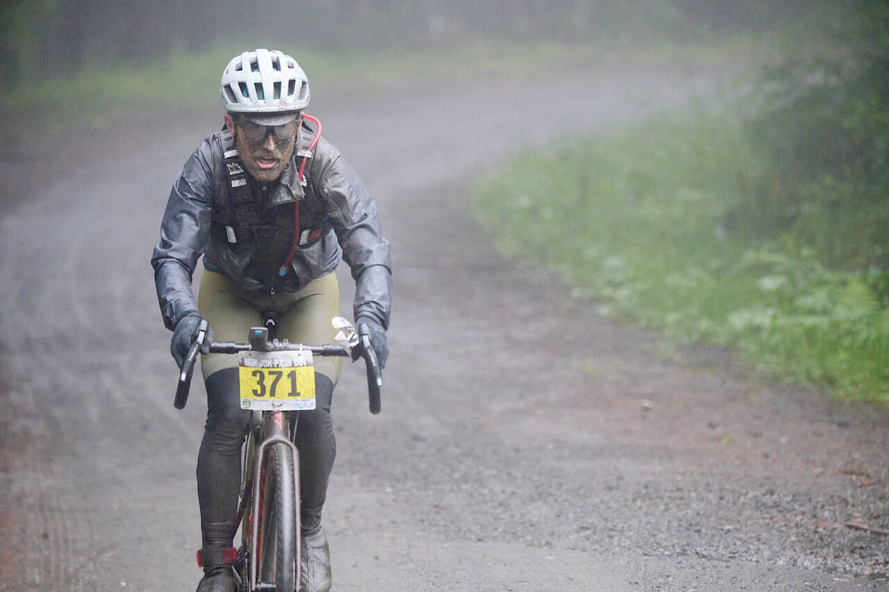 Chris DuBois battles the elements on the road during Saturday’s Gravel Unravel in the mountains northwest of Quilcene. DuBois, of Seattle, raced on the 55-mile-long course. (Dan James/Peninsula Adventure Sports)