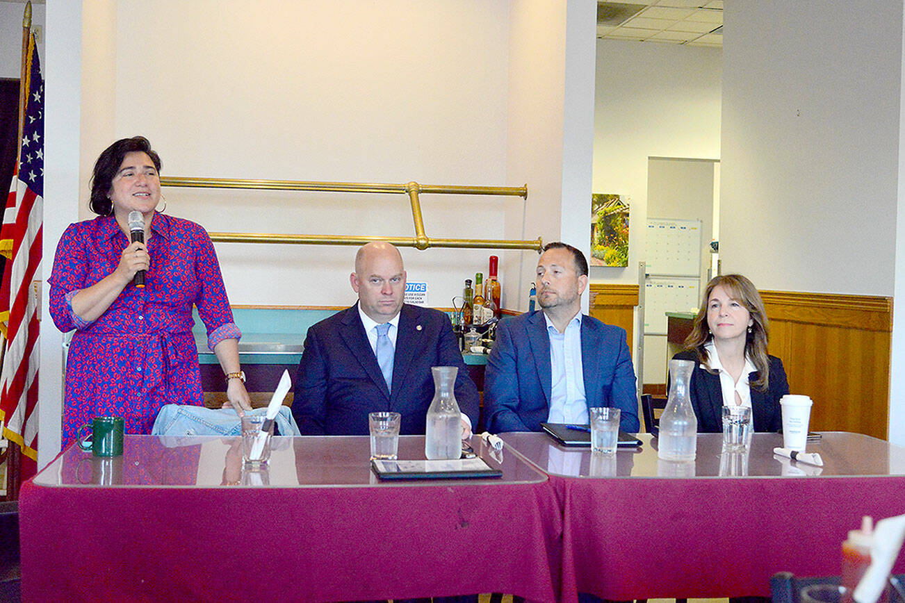 From left to right, State Sen. Emily Randall, D-Bremerton, state Sen. Drew MacEwen, R-Union, Port Angeles attorney Graham Ralston and Commissioner of Public Lands Hilary Franz, all candidates for Washington’s 6th Congressional District, appear before the Port Angeles Business Association on Tuesday to answer questions about their priorities for serving in Congress. (Peter Segall/Peninsula Daily News)