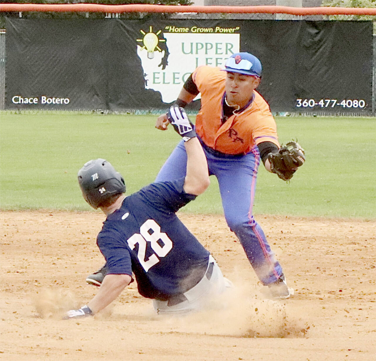 Lefties shortstop Roberto Garza-Nunez gets the tag down in time to get the Kelowna runner out on his attempted steal at Civic Field on Sunday. (Dave Logan/for Peninsula Daily News)