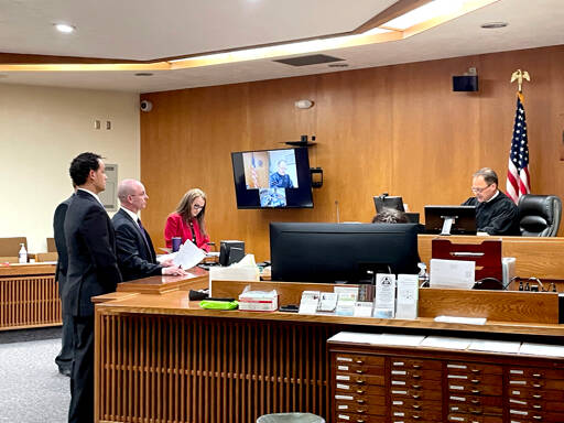 Former Olympic Medical Center emergency department physician Josiah Hill, left, was sentenced on Monday to 179 days in jail during a hearing in Clallam County Superior Court. (Paula Hunt/Peninsula Daily News)