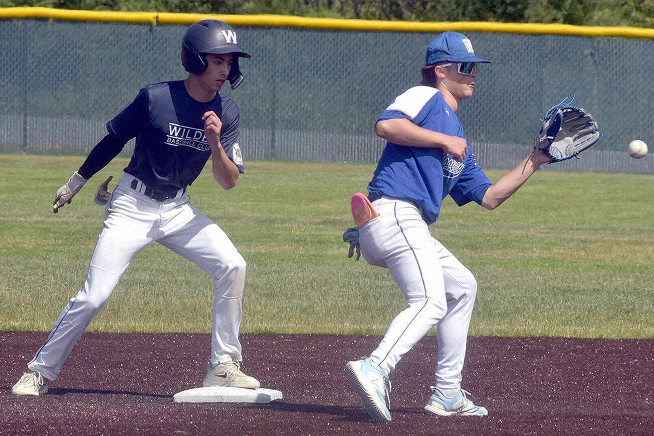 KEITH THORPE/PENINSULA DAILY NEWS
Wilder Junior's Bryce DeLeon, left, arrives at second ahead of the throw to Sedro-Woolley shortstop Cail Wilson on Tuesday afternoon at Port Angeles Volunteer Field.