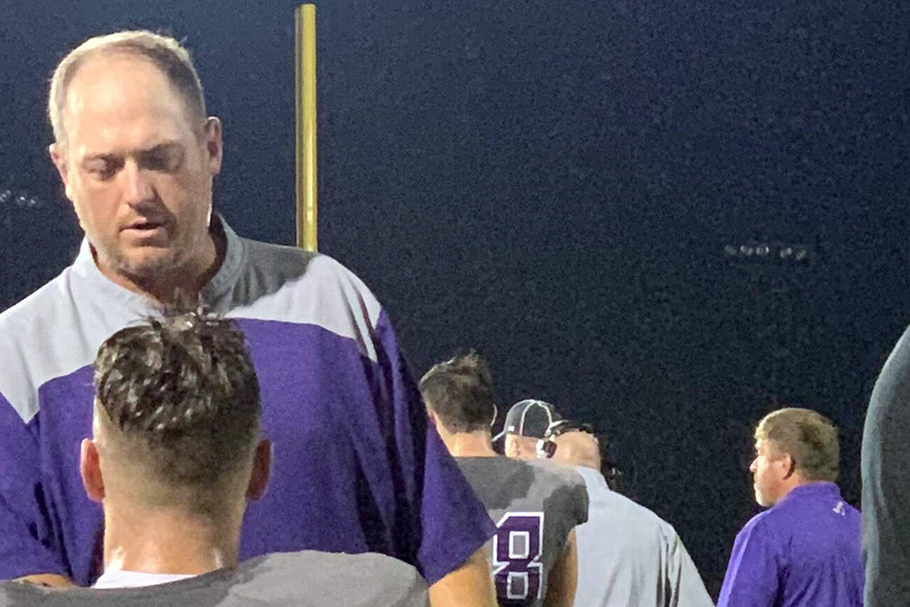New Sequim athletic director/head football coach Ian Henley speaks with a Timber Creek (Keller, Texas) player on the sidelines. Henley previously served as associate head coach and special teams coordinator for the school, which plays in 6A, the largest classification in Texas.