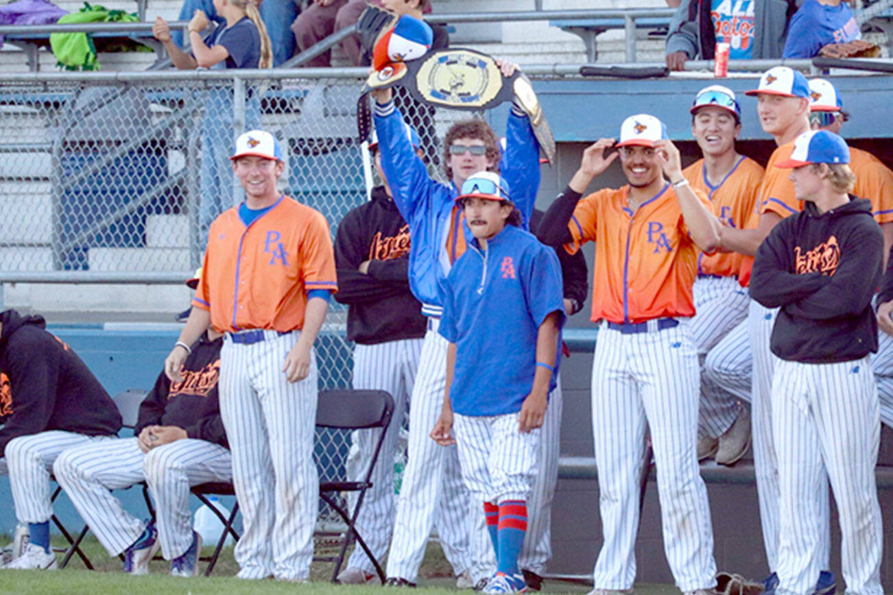 Port Angeles Lefties’ Spencer Dickinson holds the team’s home run championship belt after connecting on his second long ball in as many games at Civic Field Tuesday night against the Redmond Dudes. (Maevis Photography)