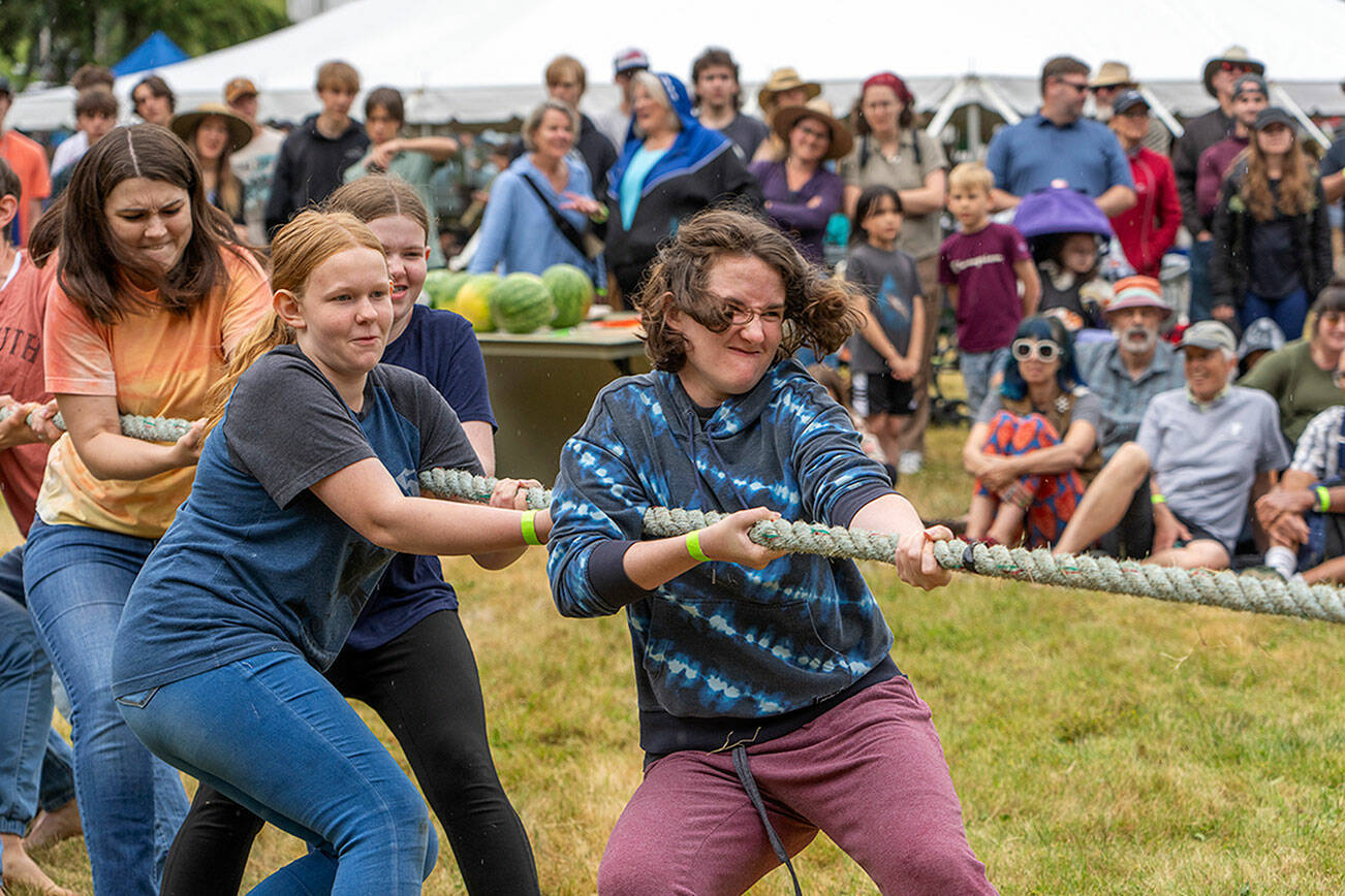 Steve Mullensky/for Peninsula Daily News
Muscles strain and faces grimace during a tug-o-war contest at the Field Day on Littlefield Green at Fort Worden State Park on Saturday.