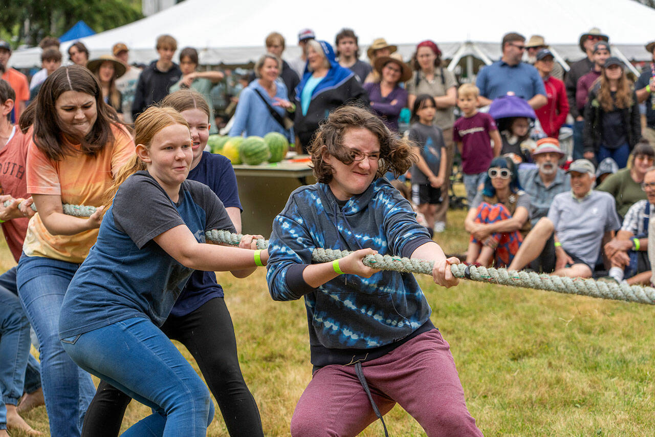 Muscles strain and faces grimace during a tug-o-war contest at the Field Day on Littlefield Green at Fort Worden State Park on Saturday. (Steve Mullensky/for Peninsula Daily News)