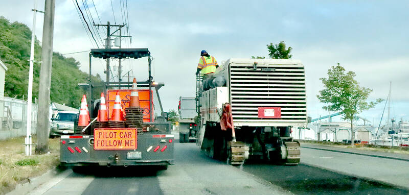 A new layer of pavement will be laid on Marine Drive in Port Angeles between the Tumwater Truck Route and Hill Street. A pilot vehicles on Monday guides travelers along the road as the project progresses. (Dave Logan/for Peninsula Daily News)
