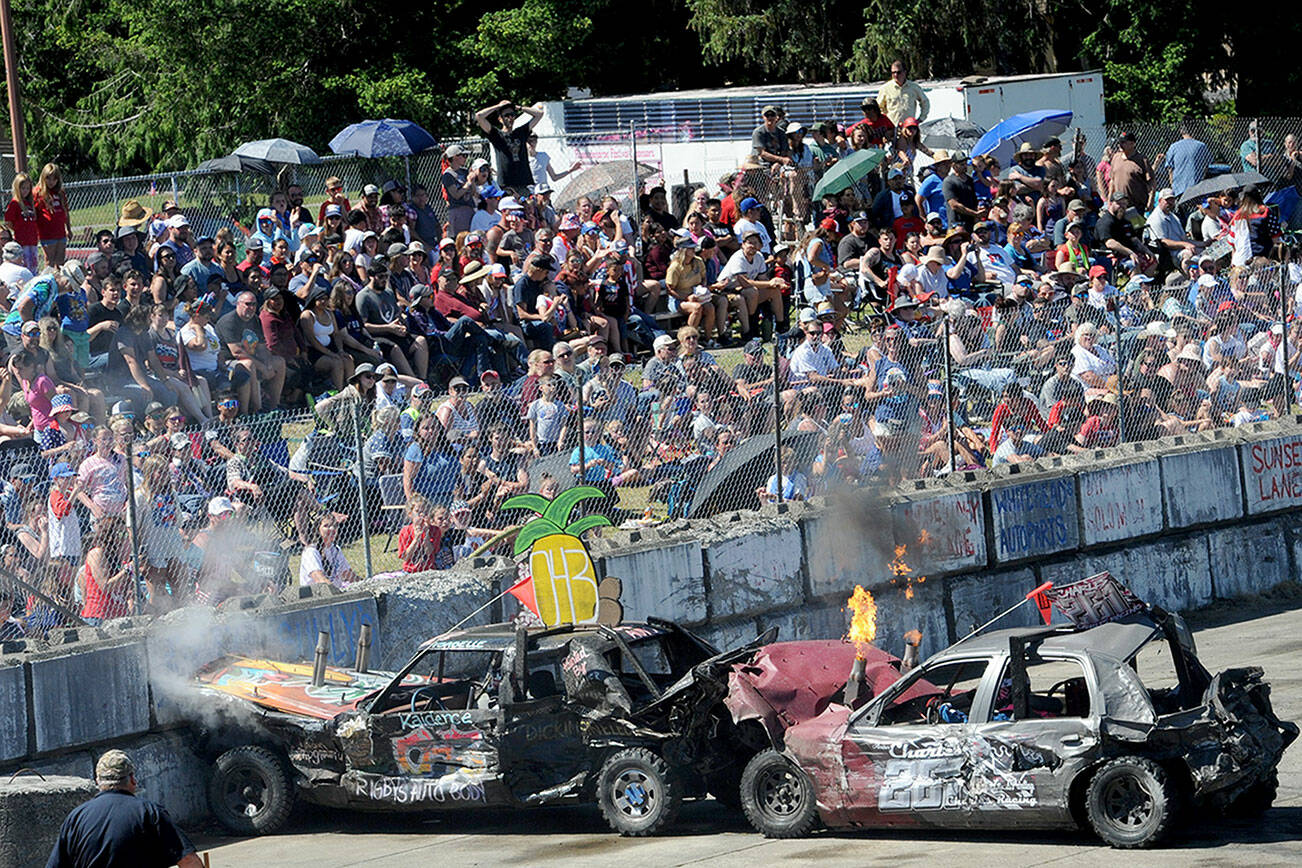 There was a lot of smoke and flames during the Forks Fourth of July celebration at the  Tillicum Park Arena as a large crowd gathered to watch their favourite demolition cars in action.  Photo by Lonnie Archibald.