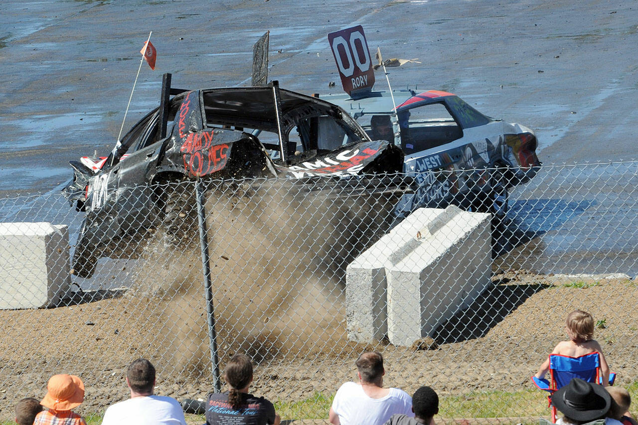 The West End Motors car slammed the number 41 car half way out of the arena during the Forks Old Fashioned Fourth of July celebration Thursday afternoon at Tillicum Park.
Lonnie Archibald/for Peninsula Daily News