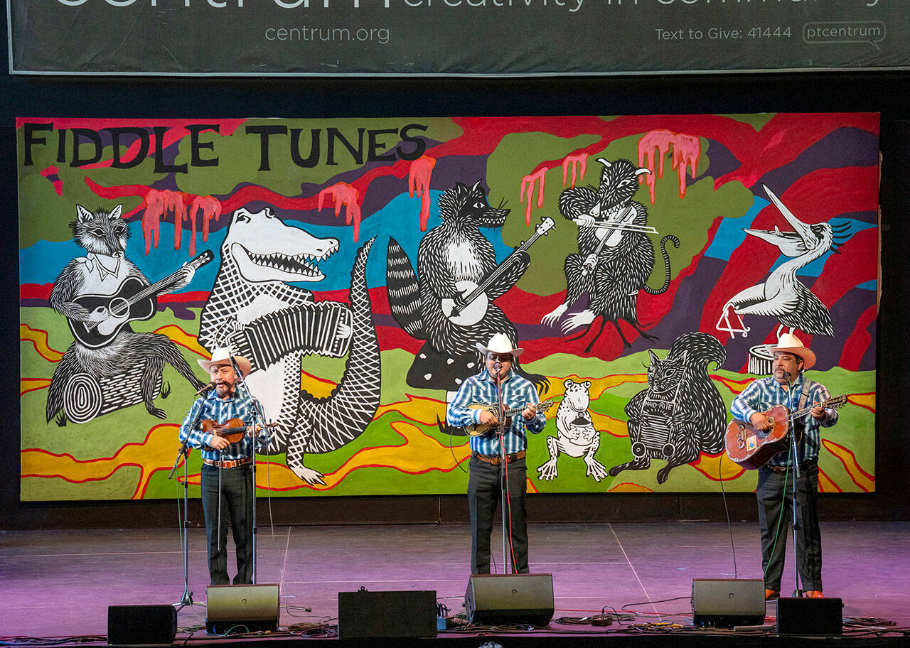 A trio, Canto a Mi Tierra of Veracruz, Mexico, with Osiris Ramses Caballero Leon, left, Bernabe Hernandez Orozco, center, and Fernando Hernandez Orozco, play a set of traditional Mexican music originating in the six states of northeastern Mexico in McCurdy Pavilion on Saturday in one of the final concerts to close out the week of Fiddle Tunes presented by Centrum at Fort Worden. (Steve Mullensky/for Peninsula Daily News)