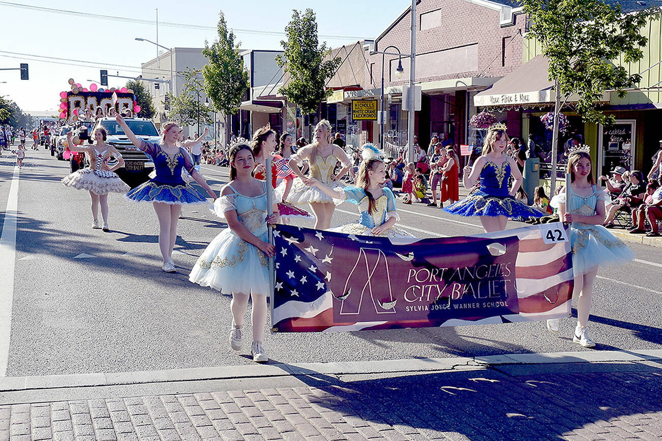 Members of the Port Angeles City Ballet march in the Independence Day Parade. The entry took first place in judging for Outstanding Float. (Keith Thorpe/Peninsula Daily News)