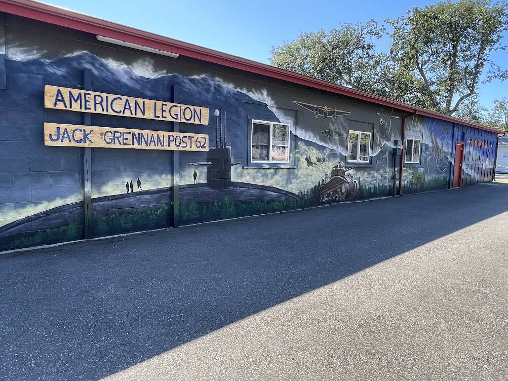 “Remember Me,” the large-scale mural on the American Legion-Jack Grennan Post 62 hall, was unveiled at a public event on Saturday. (Melissa Klein)