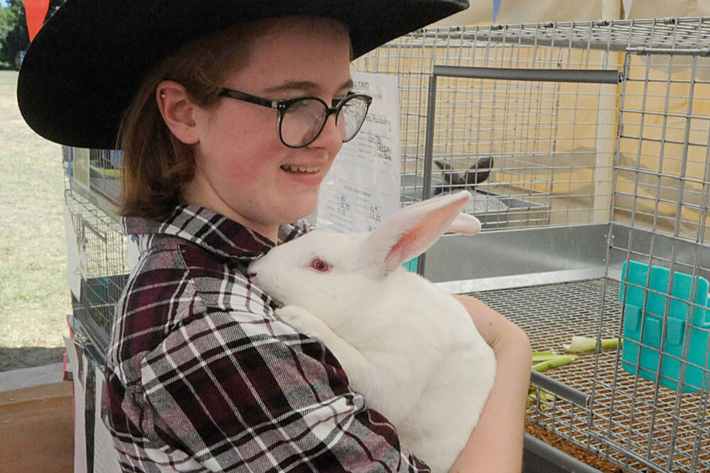 Haley Petty, 17, of Agnew earned reserve market champion with Roast the rabbit at the Clallam County Junior Livestock Auction at the Sequim Prairie Grange in 2022. This year’s auction is set for Aug. 3. (Matthew Nash/Olympic Peninsula News Group)