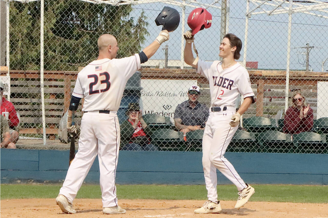 Alex Angevine of the Wilder Senior Baseball Club is congratulated by teammate Jordan Shumway after belting a home run against Lakeside Gray at Civic Field late Sunday. (Dave Logan/for Peninsula Daily News)
