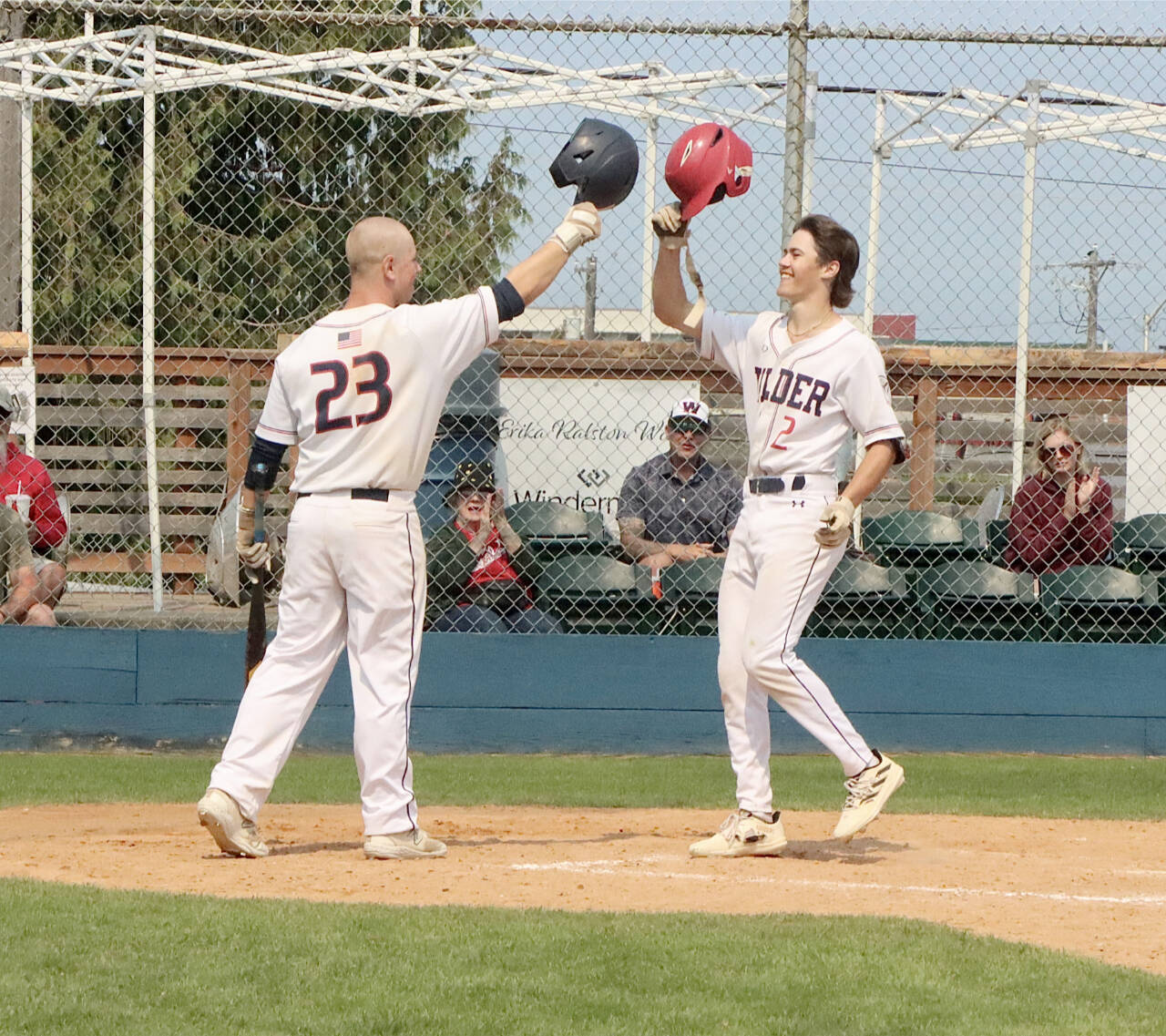 Alex Angevine of the Wilder Senior Baseball Club is congratulated by teammate Jordan Shumway after belting a home run against Lakeside Gray at Civic Field late Sunday. (Dave Logan/for Peninsula Daily News)