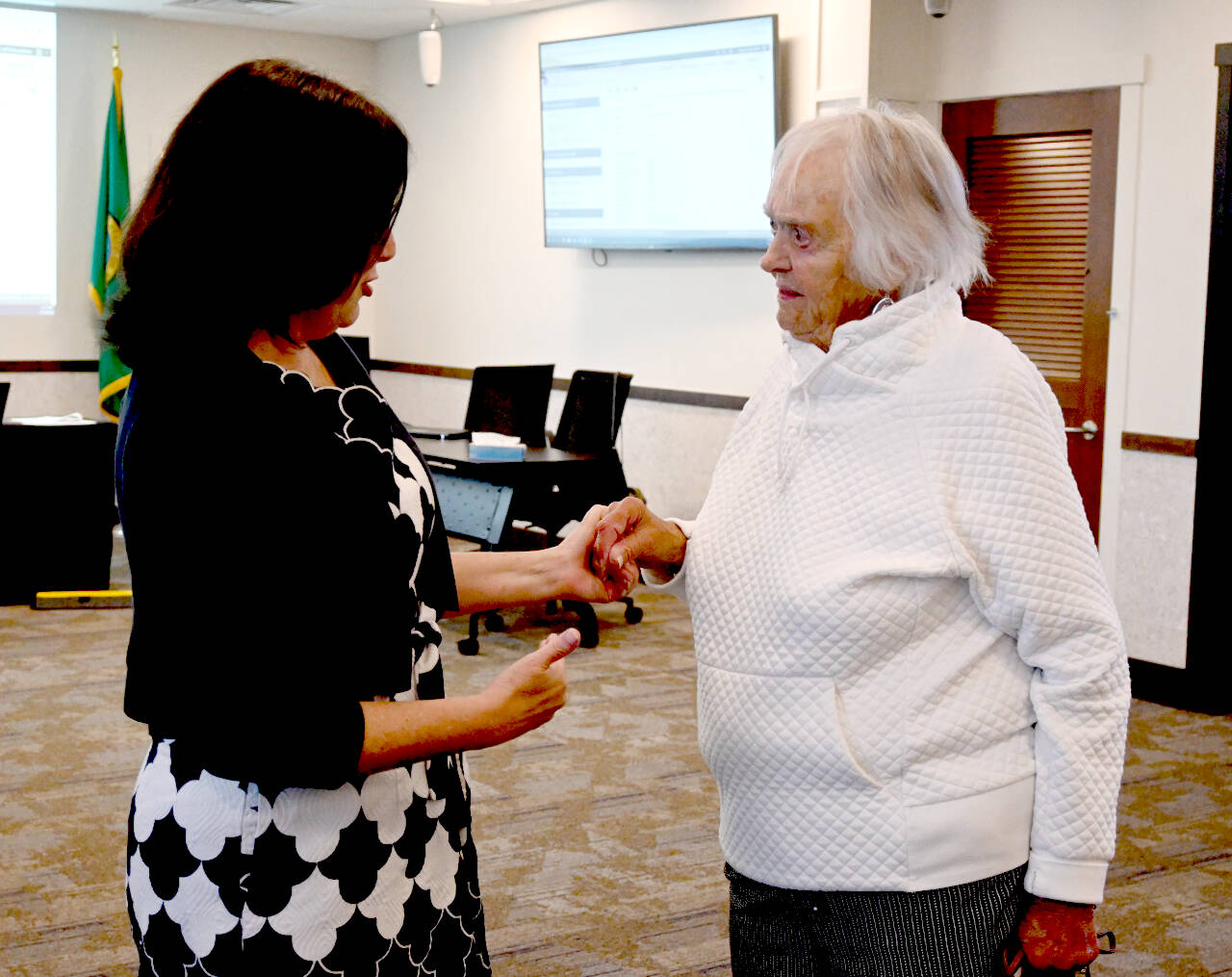 Marylaura Ramponi, right, speaks with Sequim School District superintendent Regan Nickels following the July 15 board meeting. Facilities naming committee members were unanimous in accepting Ramponi’s $1 million donation for the district’s vocational education center. (Michael Dashiell/Olympic Peninsula News Group)