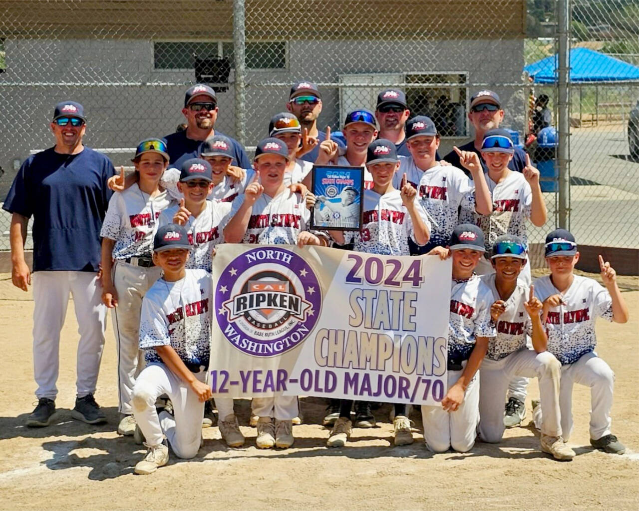 The North Olympic Cap Ripken team won the state 12 and under championship this summer in Wenatchee then finished third at regionals. From left, front row, are Julian Dominguez, Noah Kiser, Coleman Keate and Kade Johnstad. From left, second row, are Jay Lieberman, Kyler Williams, Brycen Allen, Cooper Merritt, Gavin Doyle, Jacob Kinzey, Drake Spence, Liam Shea and Carson Greenstreet. From left, back row, are coaches Grian Greenstreet, Evan Kiser, Tyril Spence, Riley Shea and manager Rob Merritt. (Courtesy of Rob Merritt)