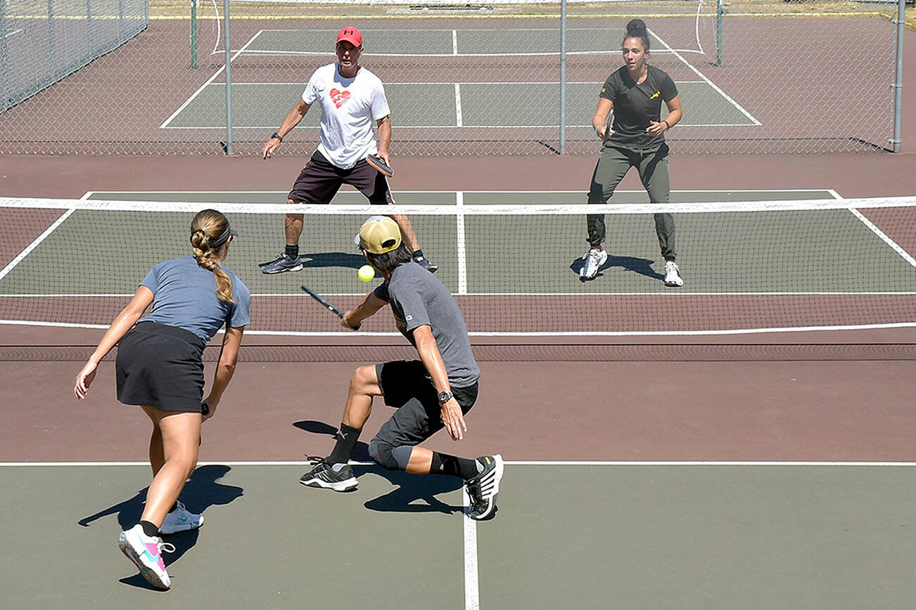 Pickleball players, clockwise from upper left, Richard Reed and Lucah Folden of Port Angeles, and Yukon Lam and Marike Nel of Sequim play on the courts at Elks Playfield in Port Angeles on Wednesday. (Keith Thorpe/Peninsula Daily News)