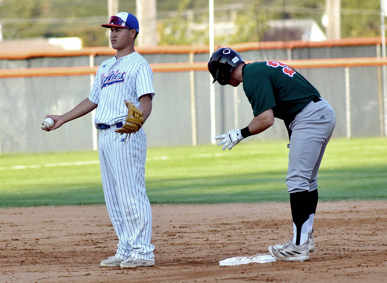 KEITH THORPE/PENINSULA DAILY NEWS Lefties’ Kosei Suzuki looks for an appeal from the umpires after Cowlitz’ Shea Bowen makes a successful dash for second base during Wednesday’s game at Port Angeles Civic Field.