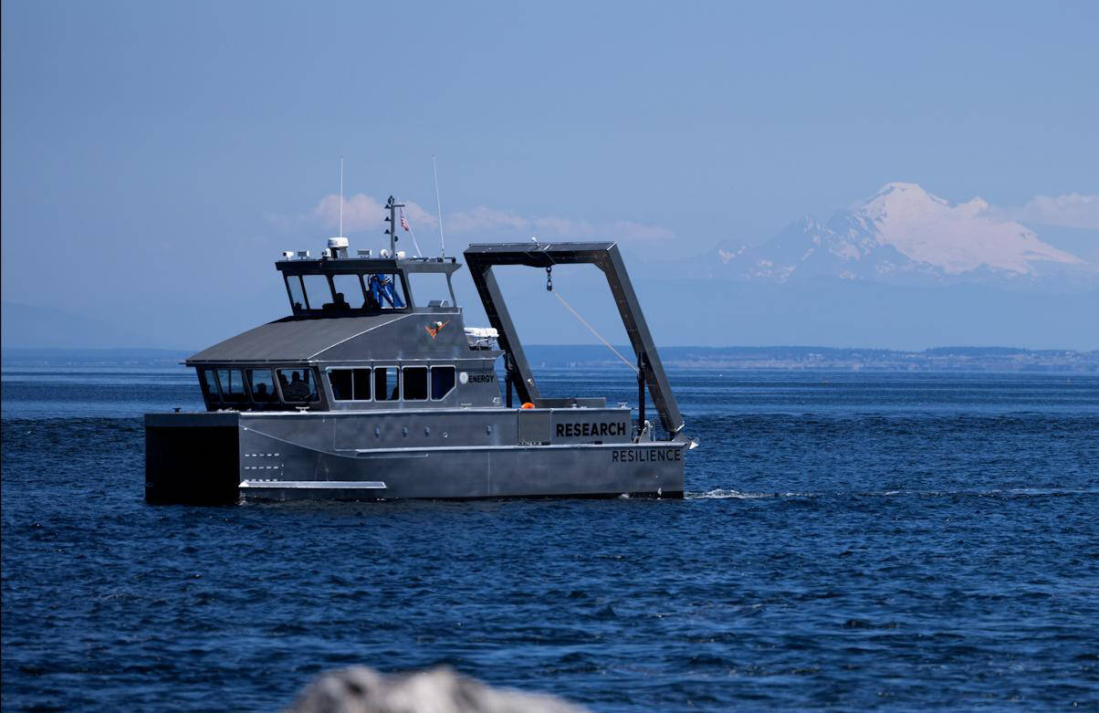 The state Department of Ecology’s first hybrid research vessel, Resilience, cruises by Sequim Bay on its way to dock at the John Wayne Marina in mid-July. The vessel will operate out of the marina for a few months while PNNL-Sequim is updating its dock. (Eric Francavilla/Pacific Northwest National Laboratory)