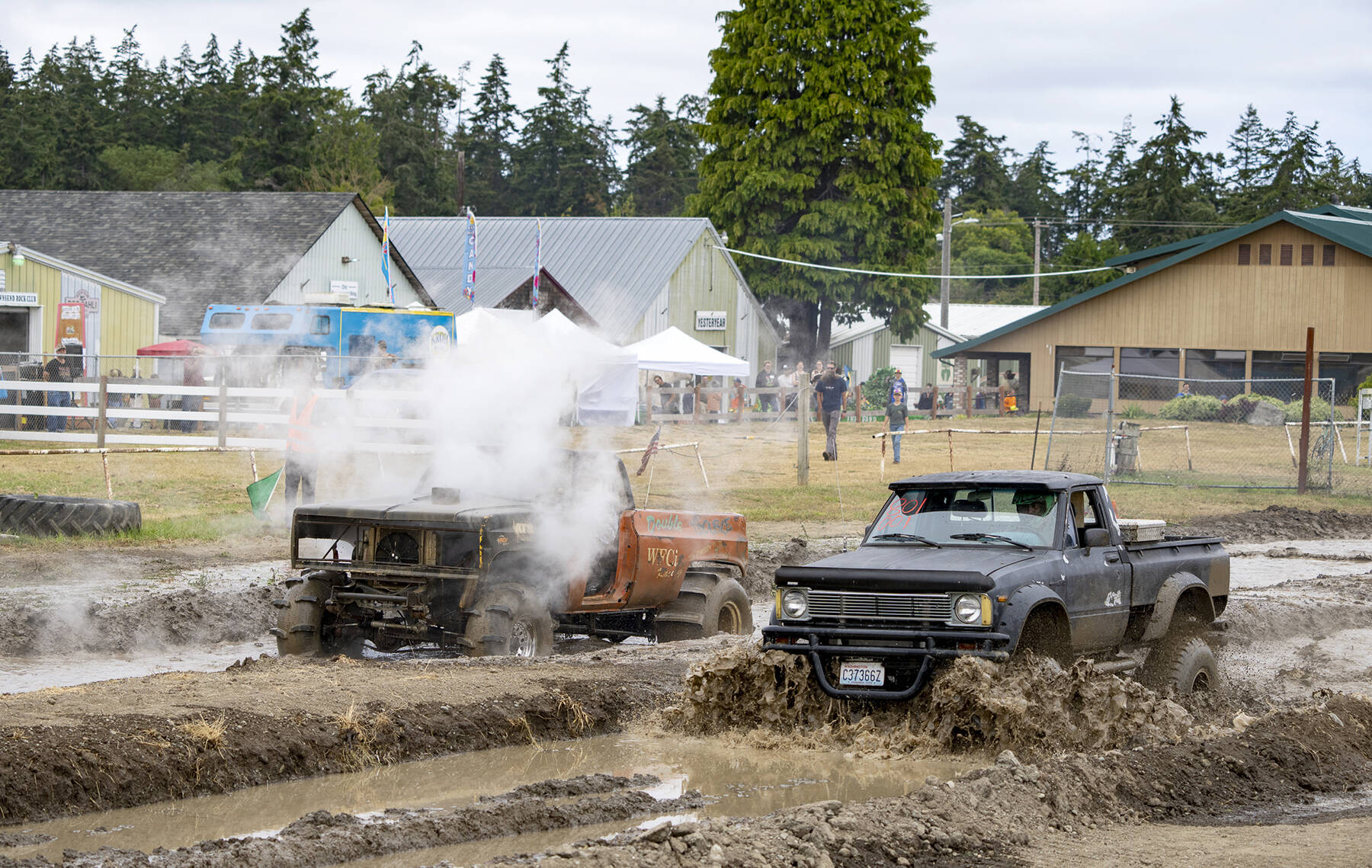 Steve Mullensky/for Peninsula Daily News
Longview’s James Baker stalls out his nitrous-oxide charged 1976 Chevy Blazer in a race against Quilcene’s Ethan Newman in his Chevy 350-powered 1980 Toyota pickup during the mud drags at the Jefferson County Fairgrounds on Sunday. The event was put on by Jeff Co 4x4.