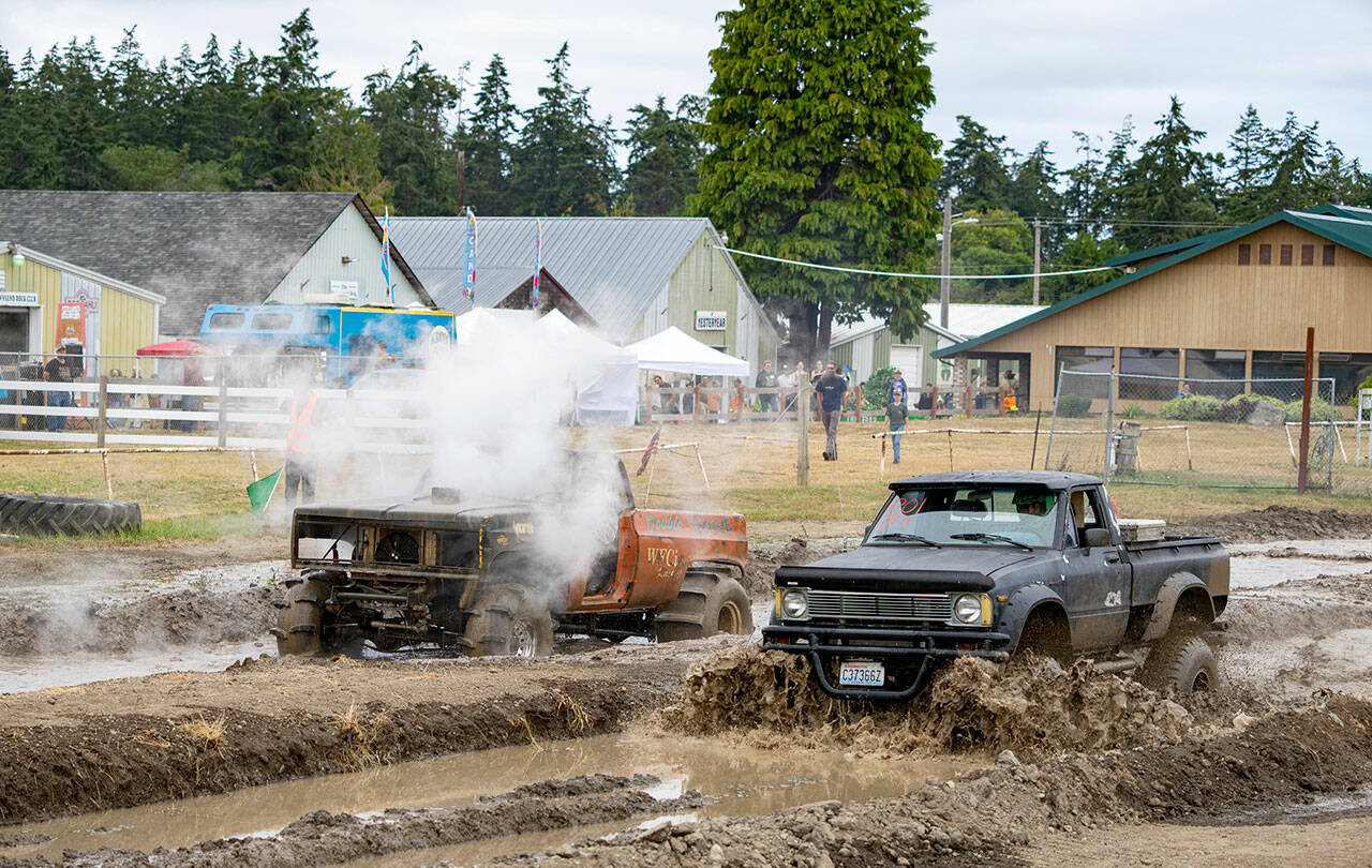 James Baker of Longview stalls out his nitrous oxide charged ‘76 Blazer in a race against Ethan Newman of Quilcene in his Chevy 350-powered 1980 Toyota pickup during the mud drags at the Jefferson County Fairgrounds on Sunday. (Steve Mullensky/for Peninsula Daily News)