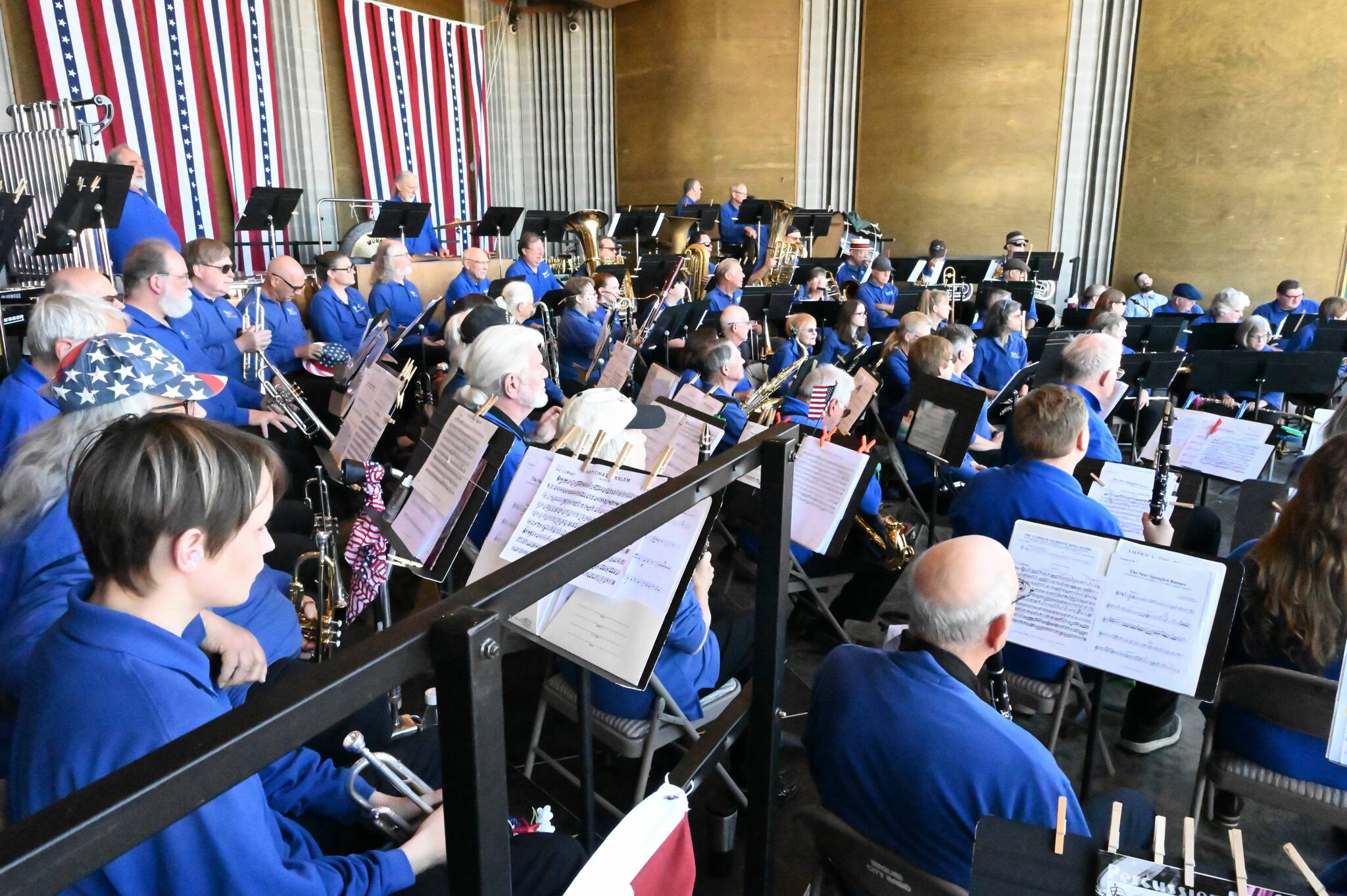 Sequim City Band musicians await the start of their Independence Day concert. The band will host “Movies, Musicals and Marches” on Sunday.