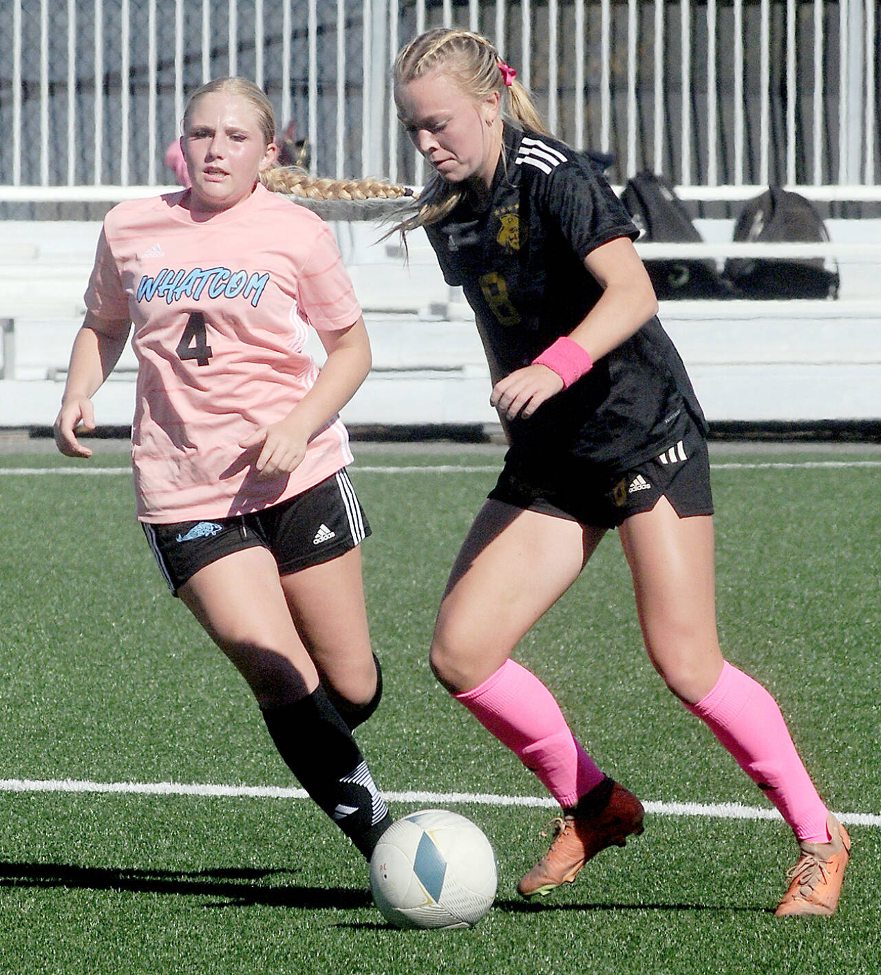 Peninsula’s Anna Petty, right, advances the ball past Whatcom’s Tori Oord during a match last year at Wally Sigmar Field in Port Angeles. Petty, who scored 12 goals last year, is back for the Pirates this season. (Keith Thorpe/Peninsula Daily News)