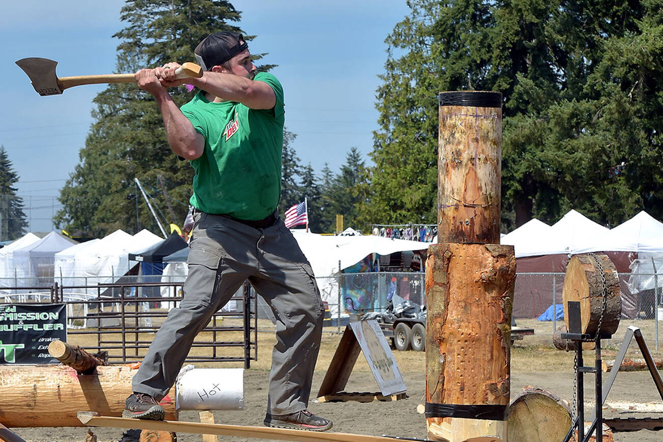 KEITH THORPE/PENINSULA DAILY NEWS
Patrick Mahoney of Raymond takes aim at his wooden target during the springboard chop competition during Saturday's logging show in the grandstands arena of the Clallam County Fair in Port Angeles. Mahoney went on to win the event against two other competetors.