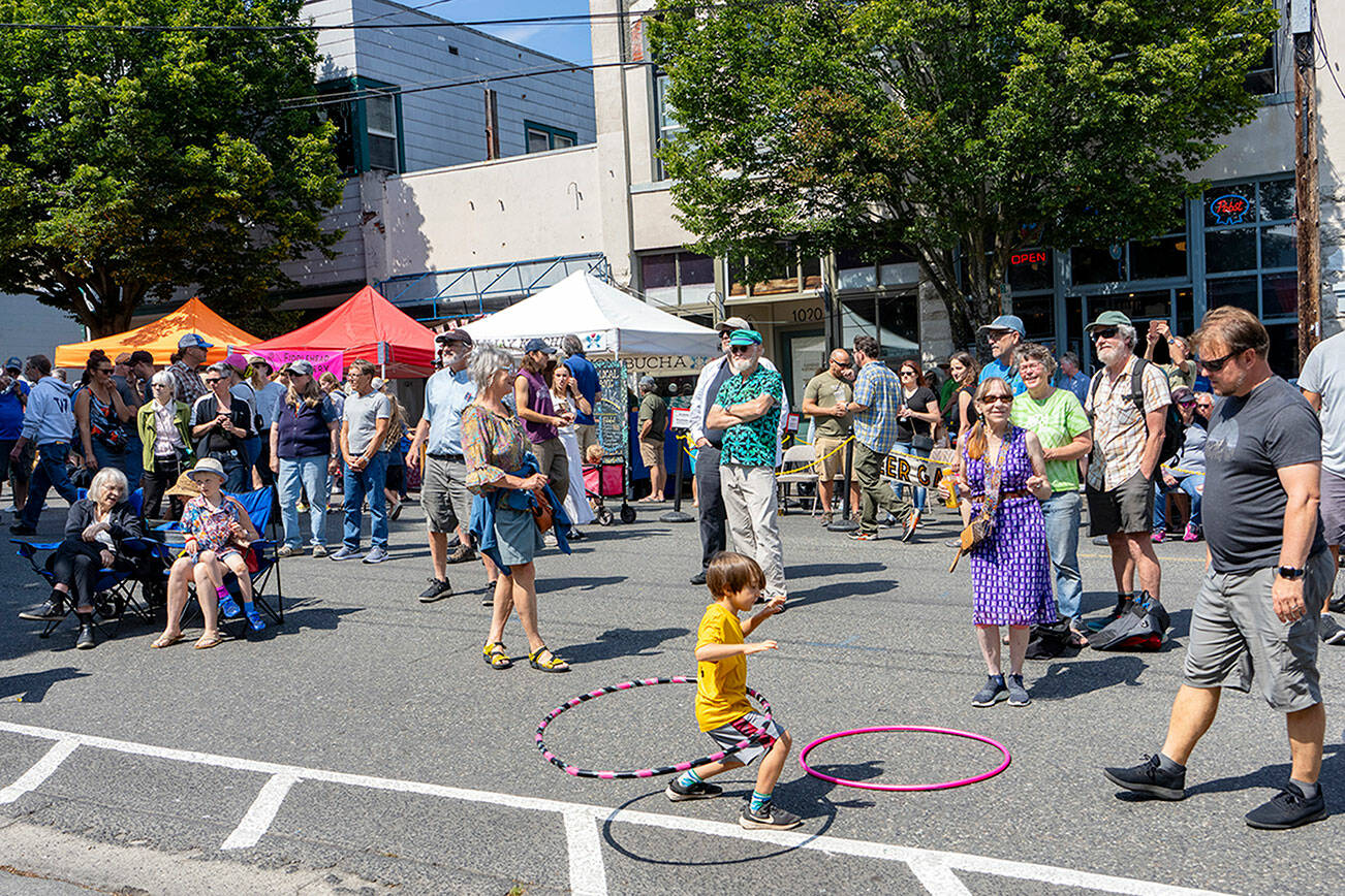 Frankie Adamson, 6, of Port Townsend swings his hips to the tunes of local band Intensive Porpoises during the 32nd Port Townsend Uptown Street Fair on Saturday. (Steve Mullensky/for Peninsula Daily News)