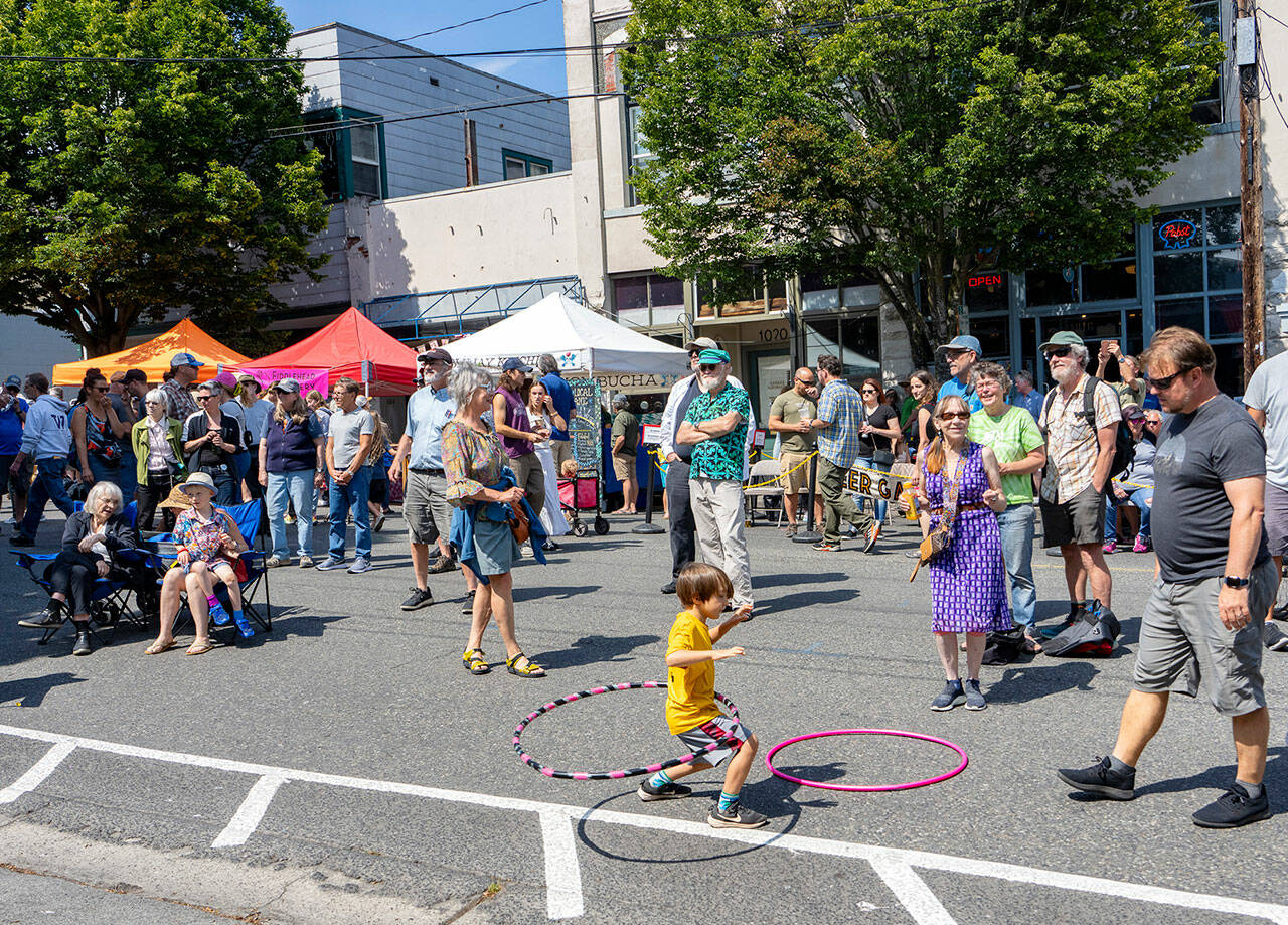 Frankie Adamson, 6, of Port Townsend swings his hips to the tunes of local band Intensive Porpoises during the 32nd Port Townsend Uptown Street Fair on Saturday. (Steve Mullensky/for Peninsula Daily News)