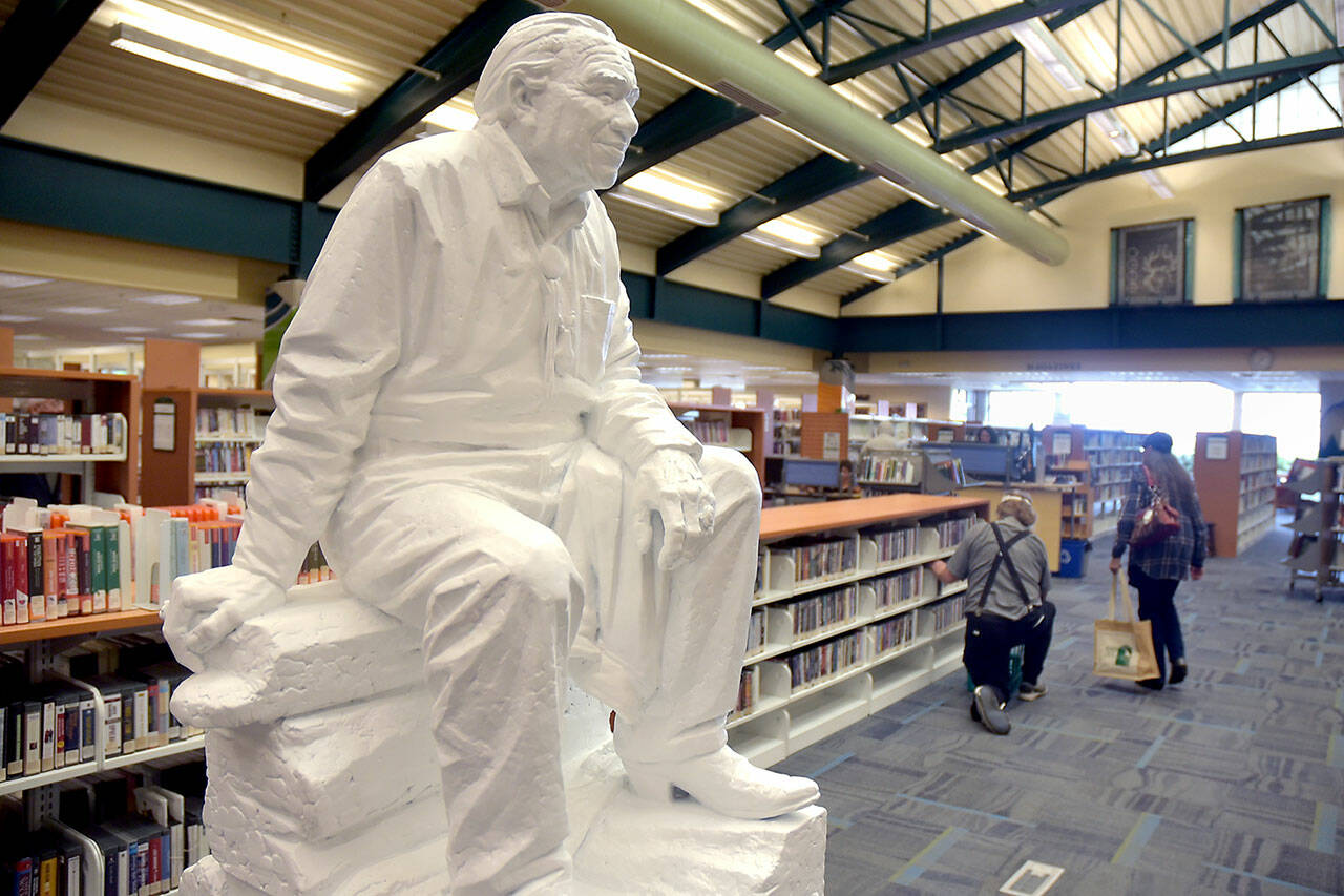 A model of a statue of Nisqually tribal activist Billy Frank Jr. by Chinese American sculptor Haiying Wu sits in the Port Angeles Public Library in conjunction with a meeting of the Northwest Indian Fisheries Commission. The model eventually will be cast in bronze and installed in the National Statuary Hall in Washington, D.C. Frank received a posthumous Presidential Medal of Freedom in 2015 for his work in fighting for tribal treaty rights and obligations. The statue will be on display at the library through Saturday. (Keith Thorpe/Peninsula Daily News)