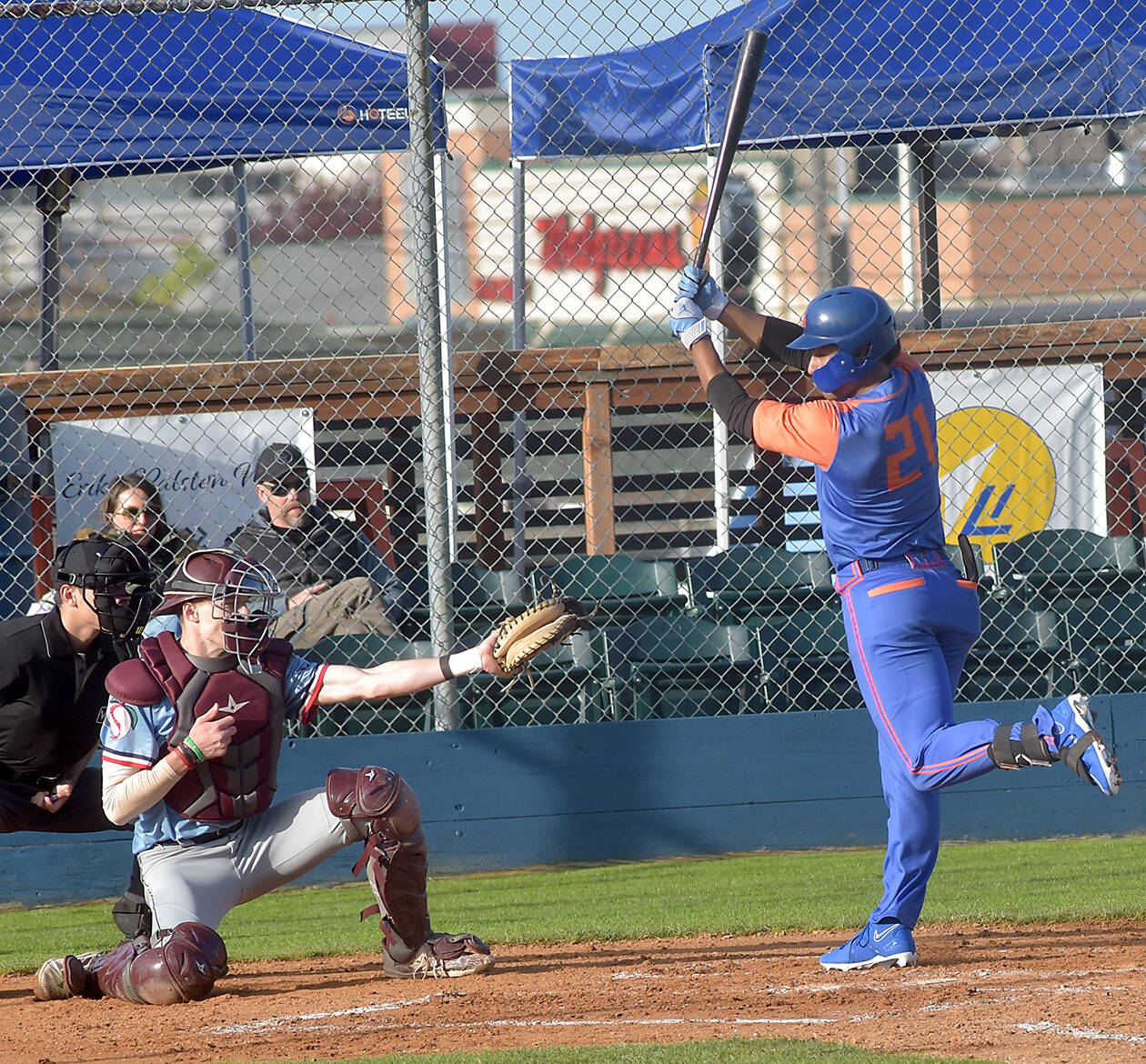 Lefties batter Roberto Garza Núñez, right, is nearly struck by an errant pitch as Wenatchee catcher Joe Scheffler receives the delivery on Wednesday in Port Angeles. (Keith Thorpe/Peninsula Daily News)