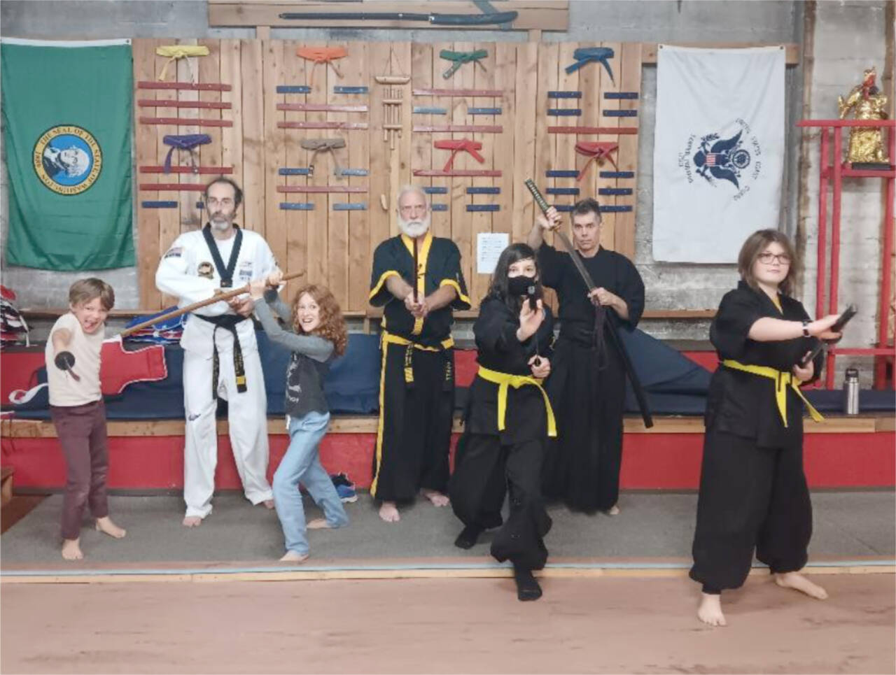 Master Alan Lindwall (in black, rear), head instructor for Seibu Ryu sword school of Iai-battojitsu of Seattle, spent Saturday at White Crane Martial Arts in downtown Port Angeles, teaching a seminar of the Japanese sword arts to the Gumdo class that practices the Korean sword arts with Grandmaster Robert Nicholls (black and gold trim, rear). The class is held at 5 p.m. Tuesdays at the dojang. (Courtesy photo)