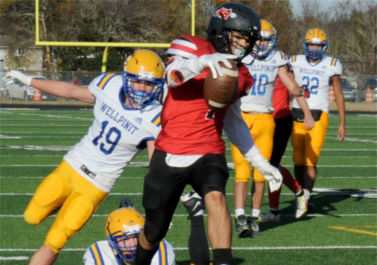 Neah Bay's Jodell Wimberley runs for a touchdown against Wellpinit in the state playoffs in 2022 in Forks. Wimberley, who rushed for 1,839 yards last year, is back for the Red Devils. (Lonnie Archibald/for Peninsula Daily News)