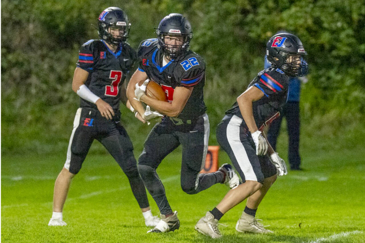 East Jefferson's Lane Martin (22) carries the football while Jackson Dupuy looks for a defender to block during a 2023 contest. Martin and Dupuy return at the skill positions for the Rivals this fall. (Steve Mullensky/for Peninsula Daily News)