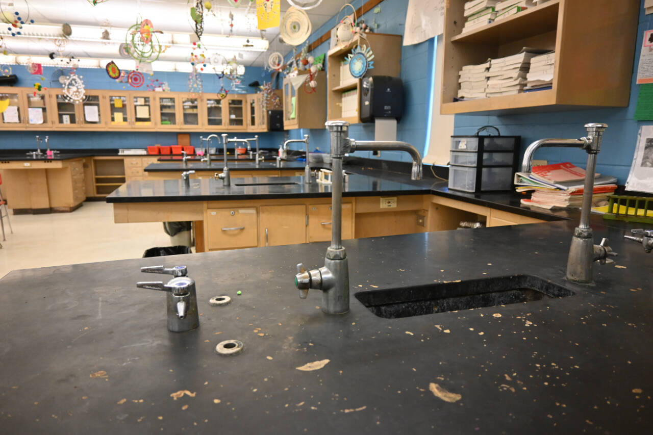 Members of the Sequim School District’s long-range facilities planning group got a look at Sequim High School’s aging science classrooms. The four classrooms were built in 1967. Adjacent to the classrooms is a storage area with rows of chemicals used in classroom studies without nearly the ventilation needed, said Mike Santos, Sequim schools’ director of facilities, operations and security. (Michel Dashiell/Olympic Peninsula News Group)