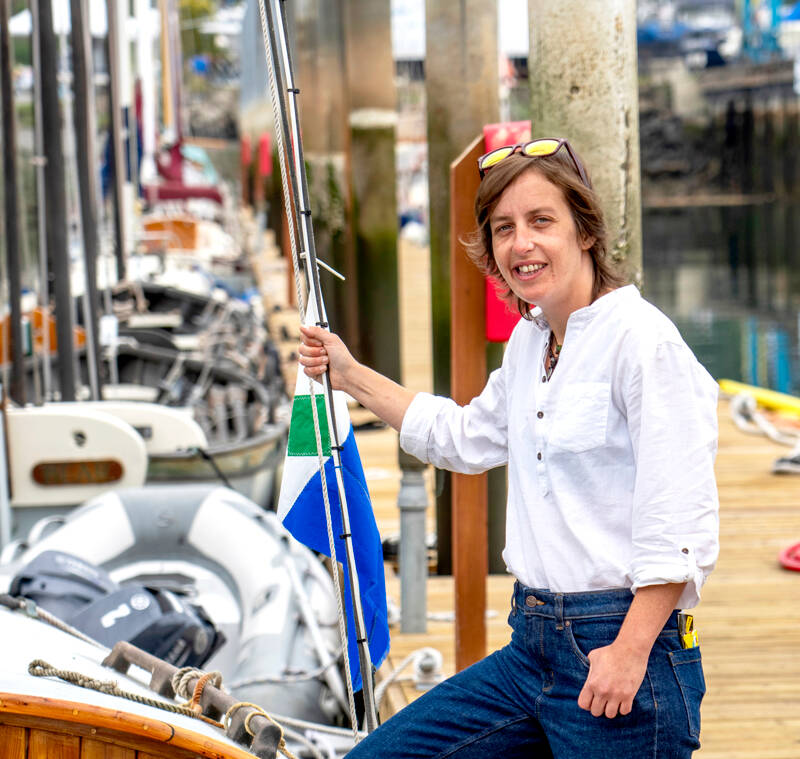 Abbey Molyneux, from Norfolk, United Kingdom, also known as Abbey the Boat Builder, poses at Northwest Maritime in Port Townsend on Tuesday. (Steve Mullensky/for Peninsula Daily News)