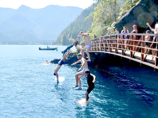 Looking to stay cool, several people jump off the Rainbow Bridge over the Devil’s Punch Bowl on the Spruce Railroad Trail on Lake Crescent in Olympic National Park over Labor Day weekend. A heat advisory has been issued by the National Weather Service with temperatures expected to reach the 80s and possibly the low 90s through today. (Dave Logan/for Peninsula Daily News)