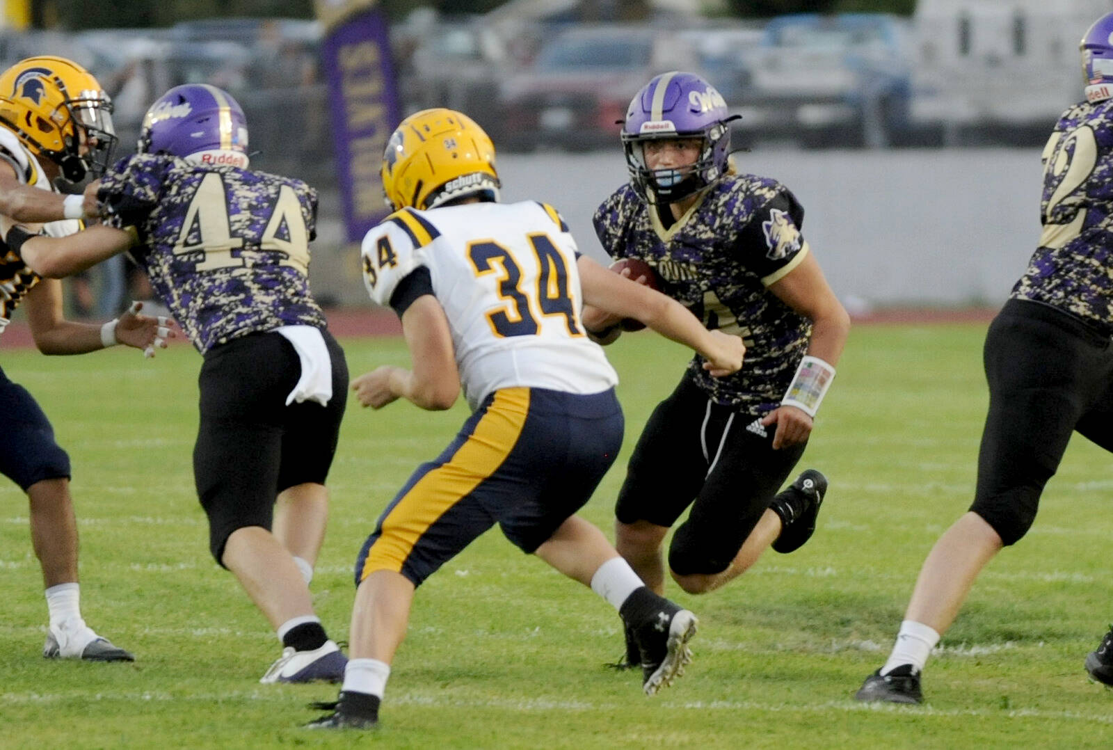 Michael Dashiell/Olympic Peninsula News Group
Sequim's quarterback Zeke Schmadeke runs with the ball against Forks. In on the play is the Spartans' Landon Thomas (34).