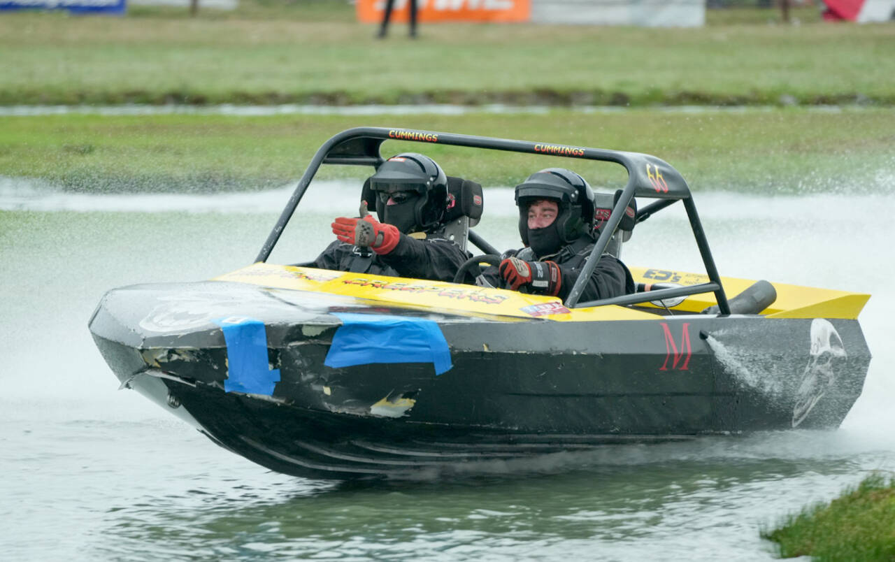 The Jeepers Creepers boat driven by Dillon Cummings of Sequim with navigator Mike McAneny makes its way through the course at the Extreme Sports Park in Port Angeles on Saturday. The finals of the sprint boat racing took place Sunday. (Jeff Halstead/for Peninsula Daily News)