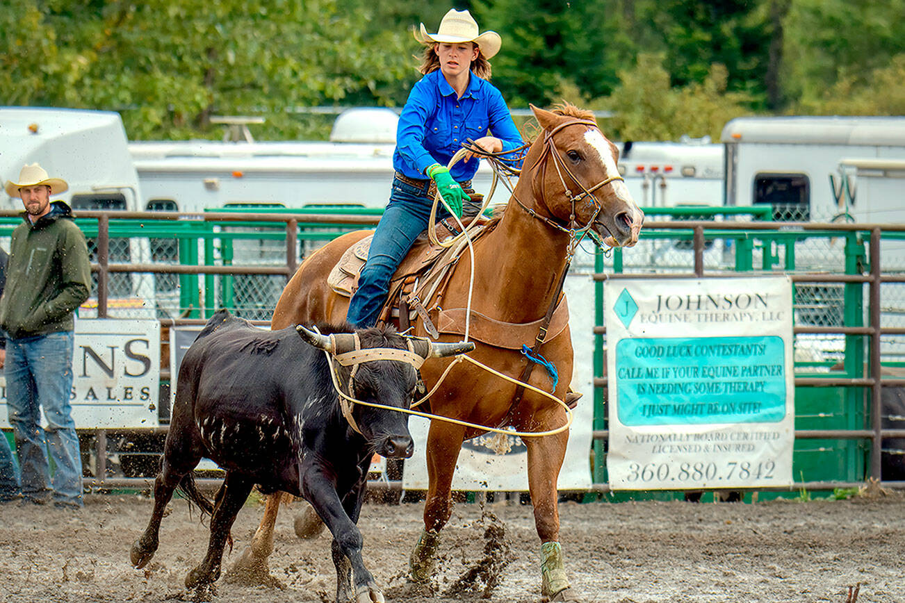 Photo by George Campbell

Cutline: Angeles’ Reegan Pare, 14, throws her lasso over the steer’s horns in the team roping event at the Peninsula Junior Rodeo in August.