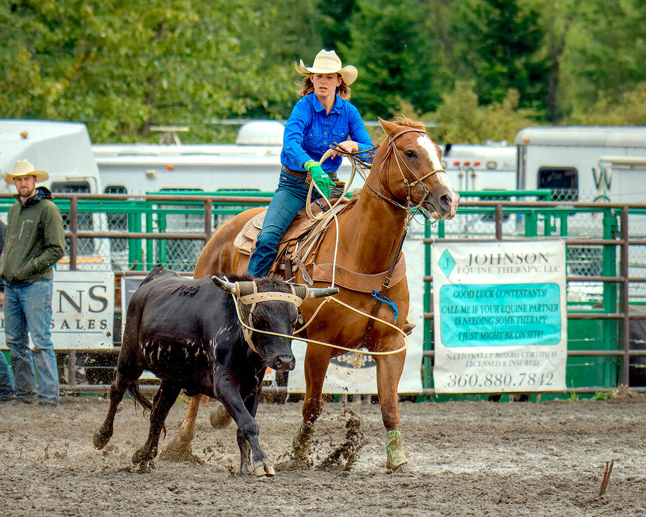 Port Angeles’ Reegan Pare, 14, throws her lasso over the steer’s horns in the team roping event at the Peninsula Junior Rodeo in August. (Photo by George Campbell)