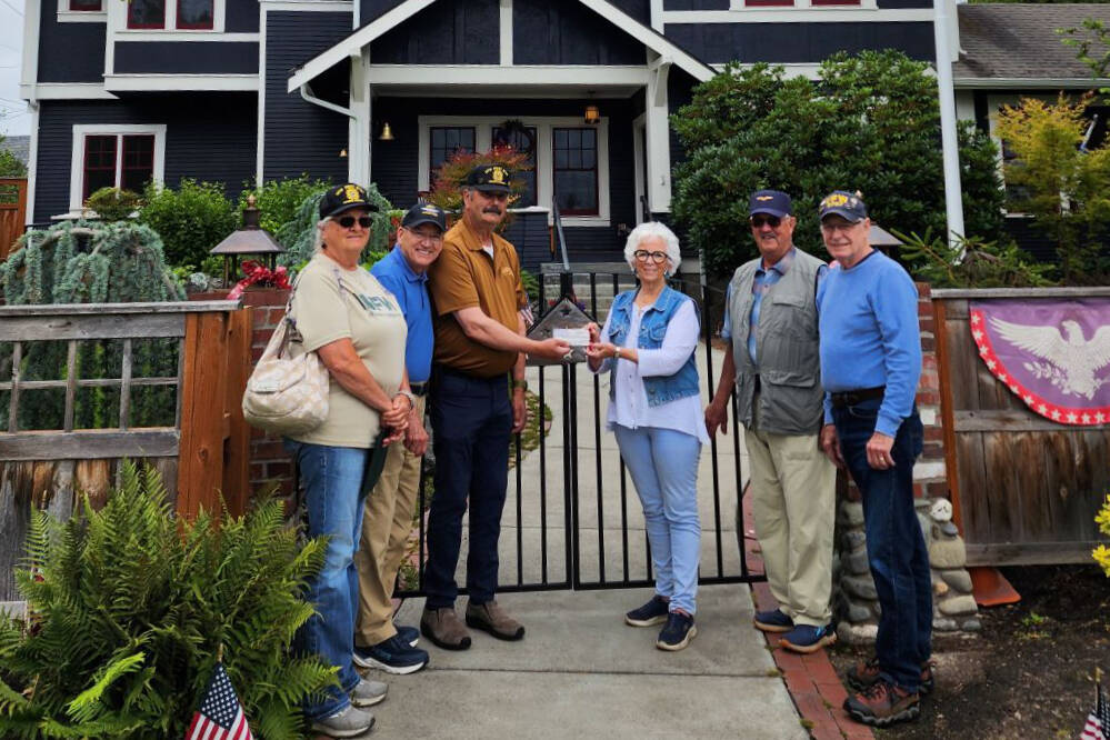 Carlsborg VFW Post 6787 representatives present a donation to the Captain Joseph House Foundation. Pictured, from left, are VFW representatives Denise Ashbran, Alan Morris and Commander Dave Yarnchak, Captain Joseph House founder Betsy Schultz, and VFW representatives Gary Vetie and Tom Cox. (Claire Rausch)