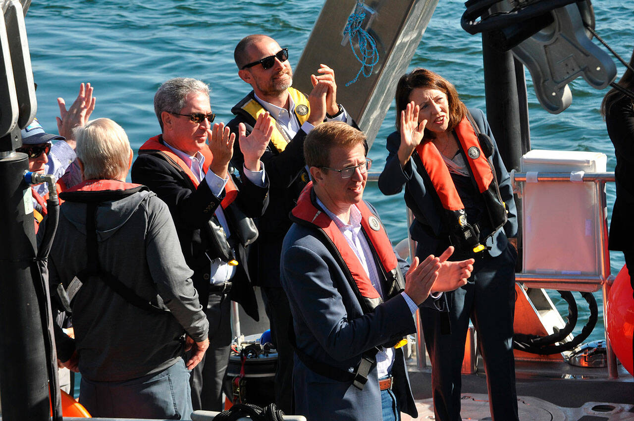 Dignitaries, including U.S. Rep. Derek Kilmer and Sen. Maria Cantwell celebrate the dedication of PNNL-Sequim’s RV Resilience, the Department of Energy’s first hybrid vessel. (Matthew Nash/Olympic Peninsula News Group)