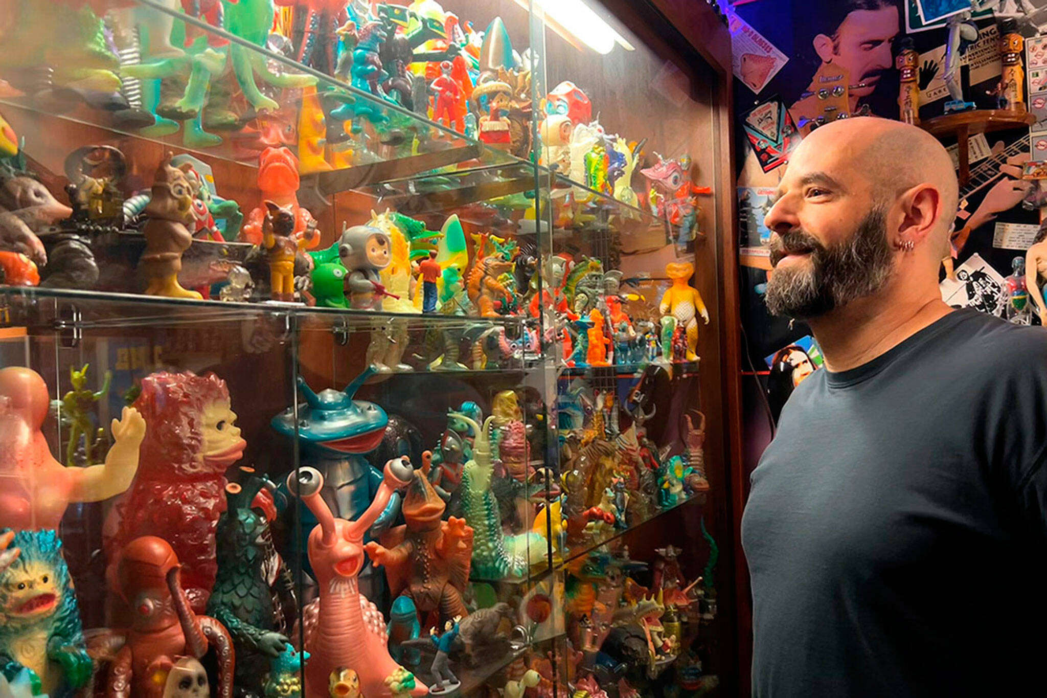 Corey Edwards, organizer of the Olympic Peninsula Toy and Collectibles Show, stands by his case of Kaiju monsters he’s been collecting since the early 2000s. He said the show on Saturday will be an option for locals to find new and old toys that they might remember from their childhood. (Matthew Nash/Olympic Peninsula News Group)