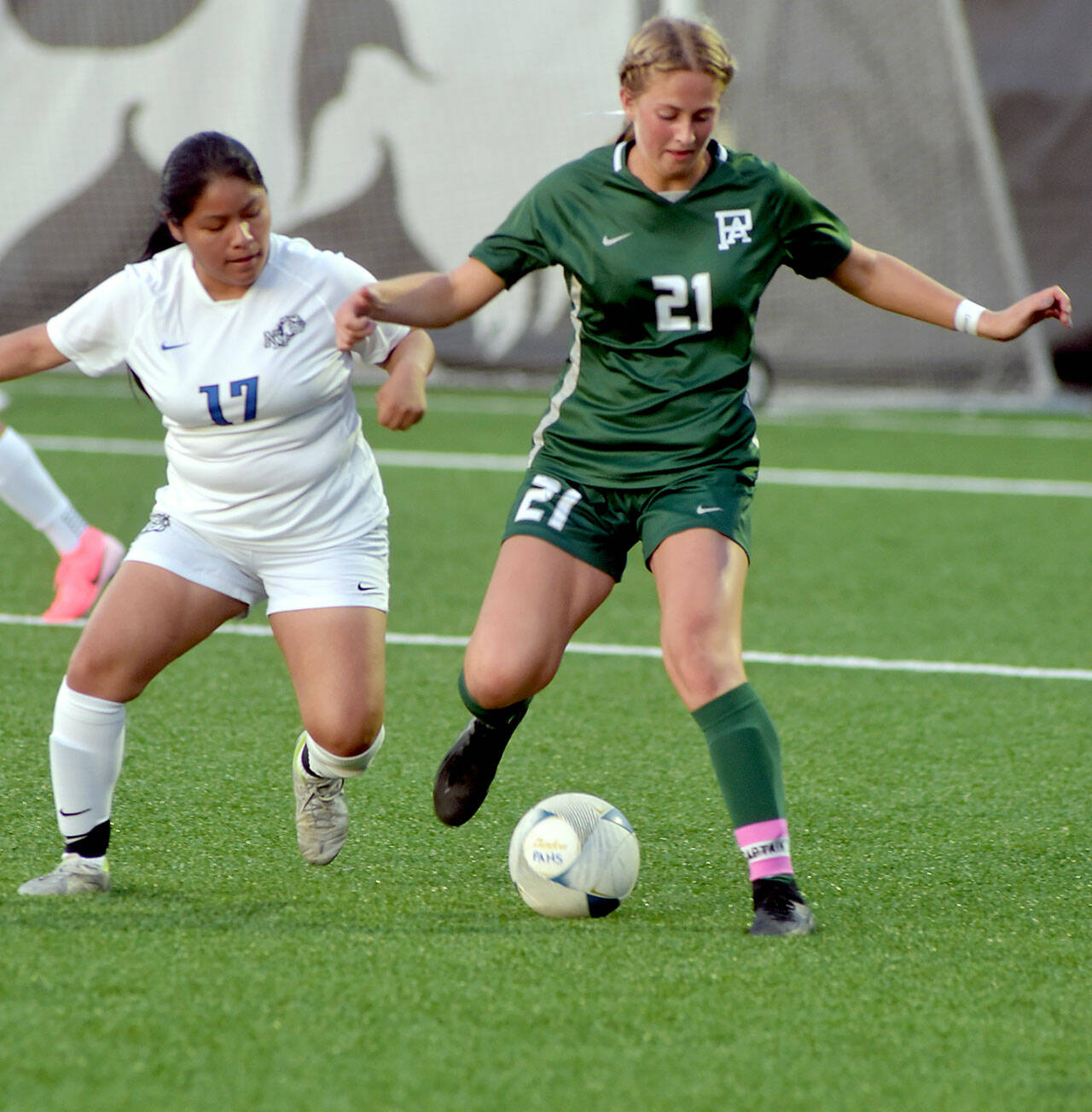 KEITH THORPE/PENINSULA DAILY NEWS Port Angeles’ Becca Manson, right, battles for the ball with North Mason’s Magdalena Miguel Sebastian on Thursday night at Peninsula College.