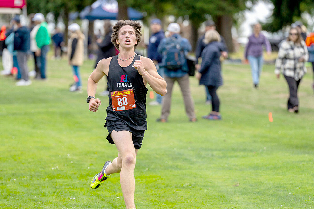 Steve Mullensky/for Peninsula Daily News

Port Townsend Rivals sophomore Josh Yearian, #80, runs all out to the tape while competing in a multi-school cross country meet on Tuesday at Camus Prairie Park Golf Club. Yearian clocked a time of 10:38.50 and placed 6th for the two mile lap around the course.